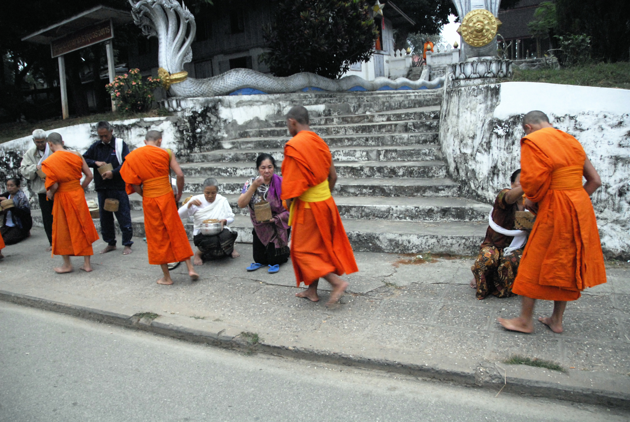 Monks and villagers in Luang Prabang