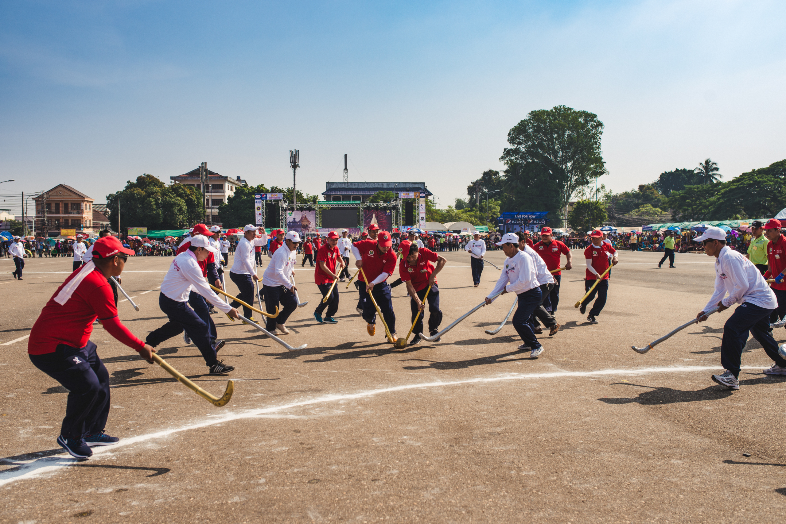 Game of tikhi, traditional Lao hockey, during the Boun That Luang festival